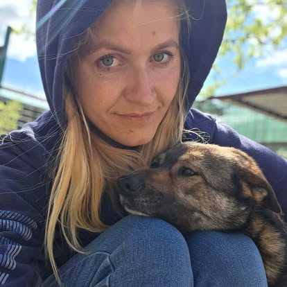 Ionela, partner rescuer in Bucharest, with one of the dogs in her care.